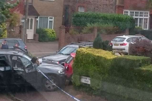 A car was spotted crashed into a garden in Manor Road. Picture: Abbey Lant