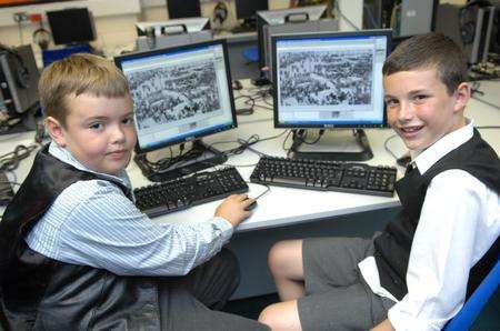 Year 4 pupils Luke and James using the KM Group's digital archive