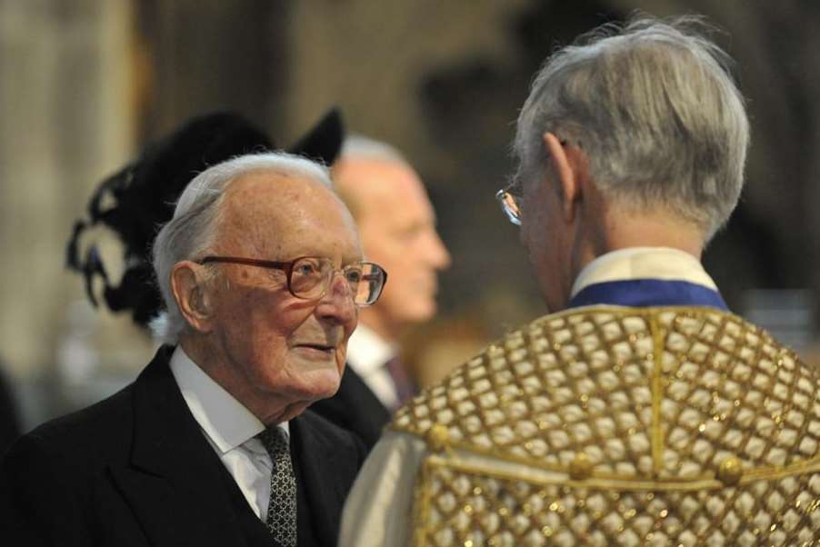 Lord Carrington makes his way into the cathedral