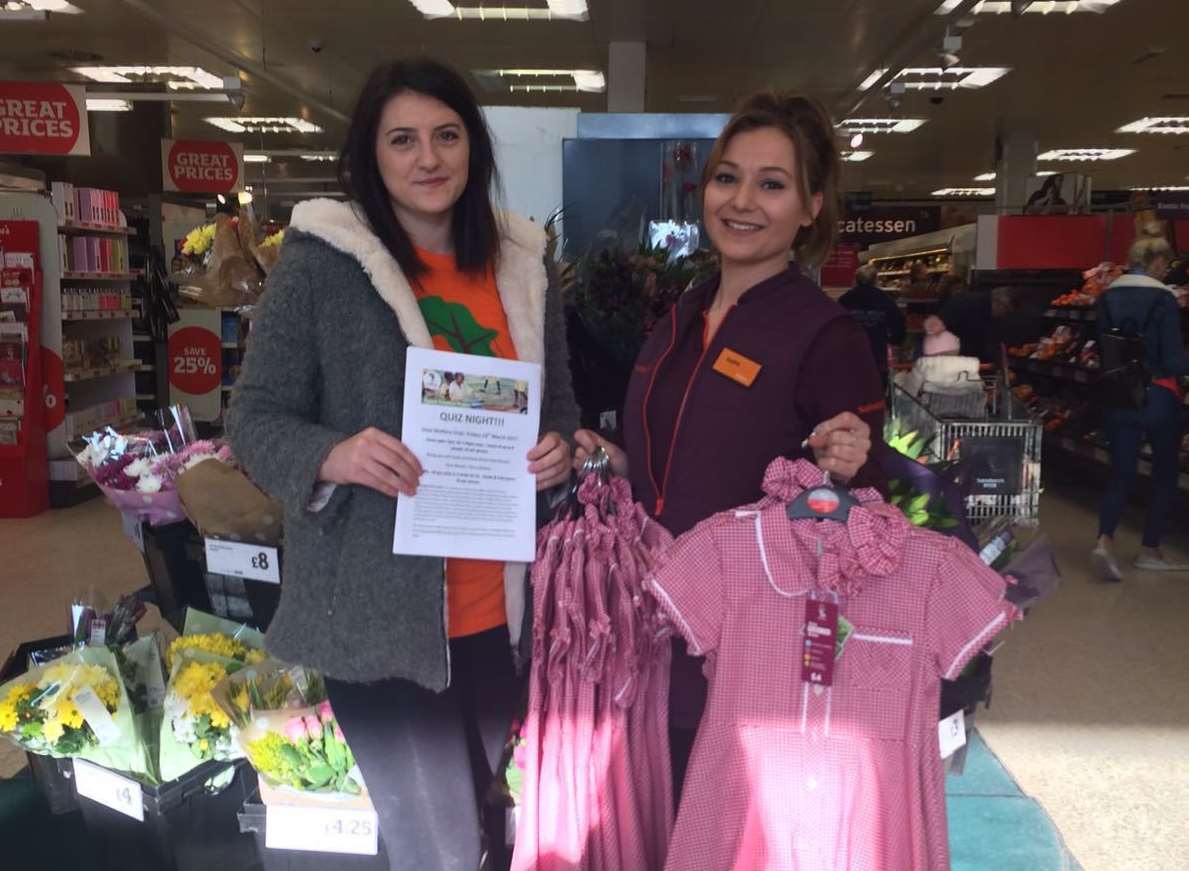 Sainsburys in Deal has given Laura Heath, pictured with Sophie Johnson, some summer dresses to take out to the school children