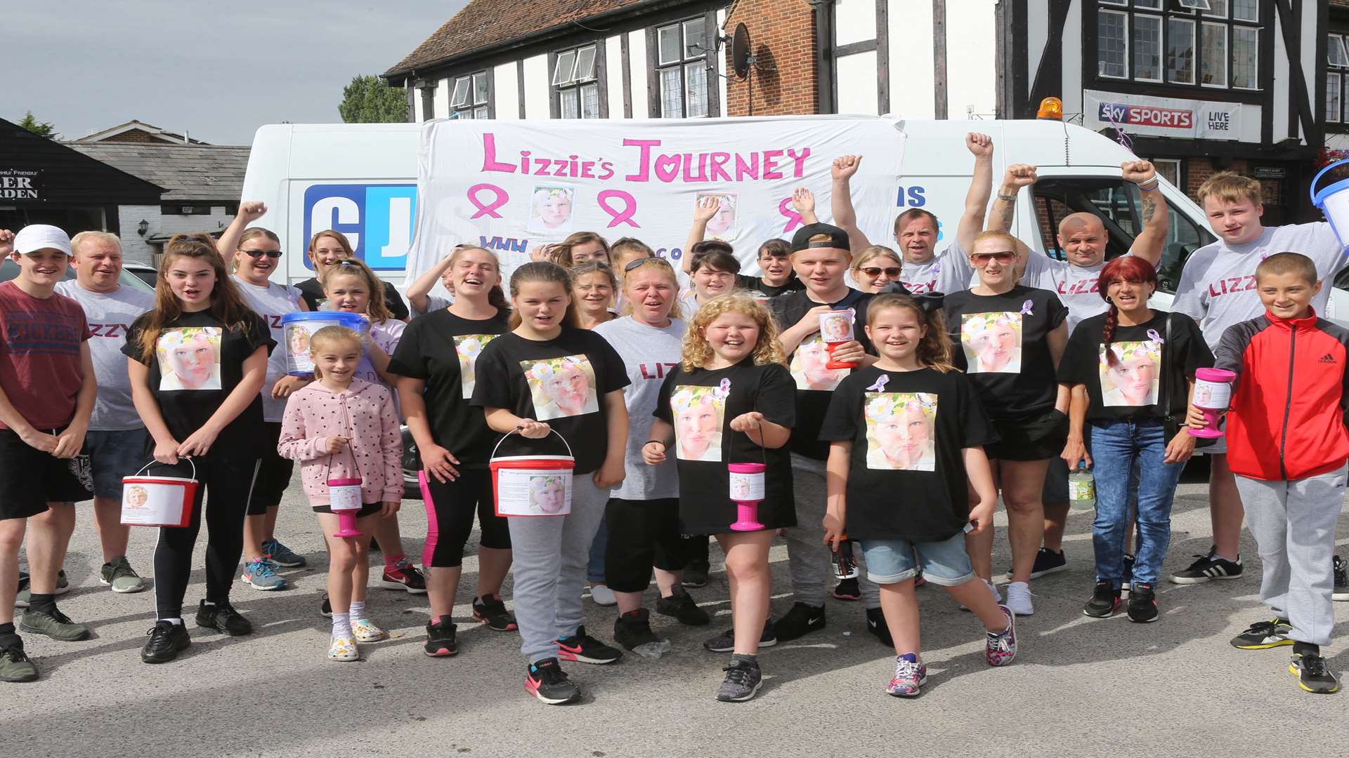 Kath Adams, centre in grey sweatshirt, surrounded by family, friends and supporters at the start of their 9-10 mile sponsored walk from Teynham to Rainham Railway Station to raise money for Lizzy Adams, who has a brain tumour.