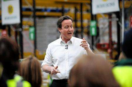 Opposition leader David Cameron talks to workers at Morrisons' distribution depot at Sittingbourne