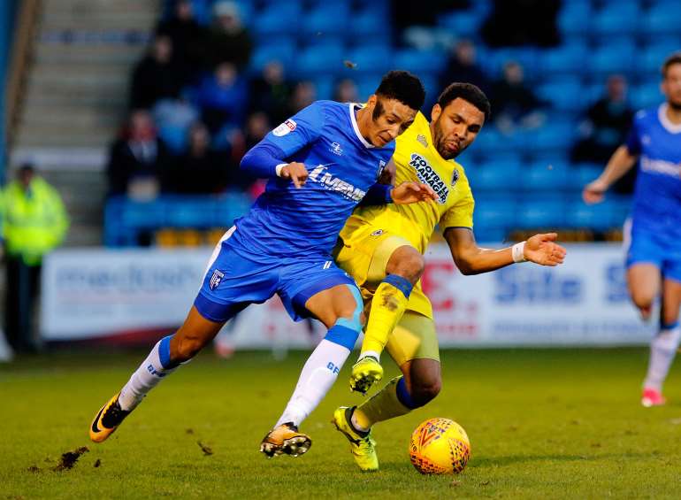 Sean Clare up against former Gills man Andy Barcham Picture: Andy Jones