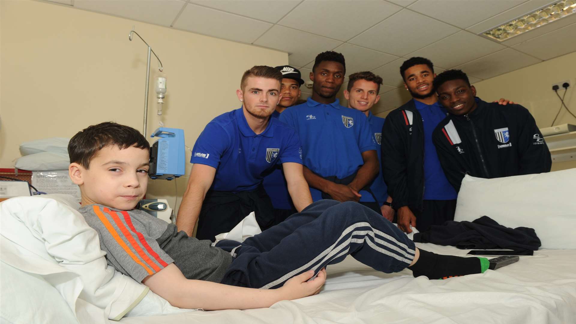 Lewis Coates, 10, is pictured with Gills players