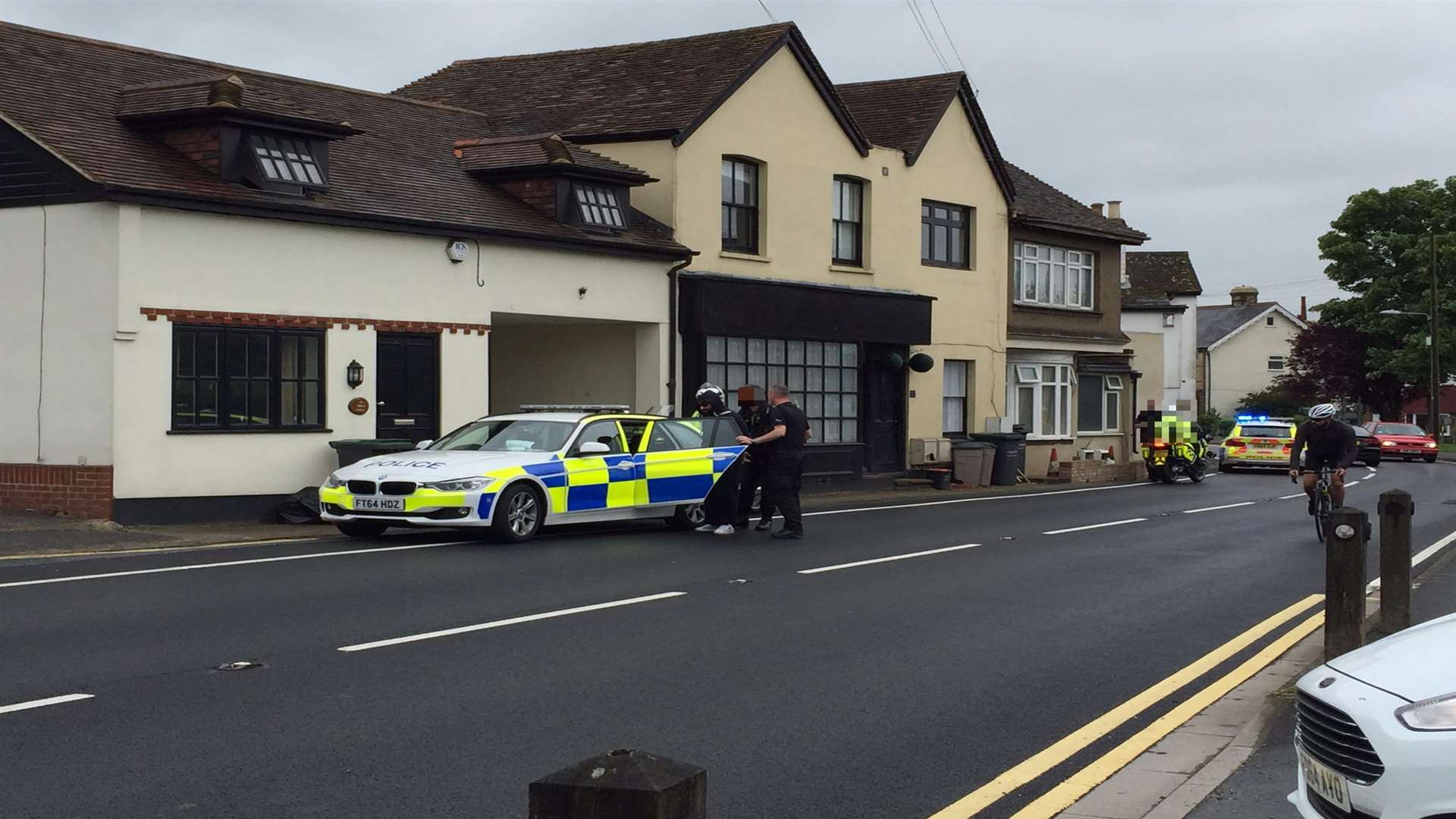 The scene at Wrotham Road, Meopham Green. We have blurred the suspect's face for legal reasons