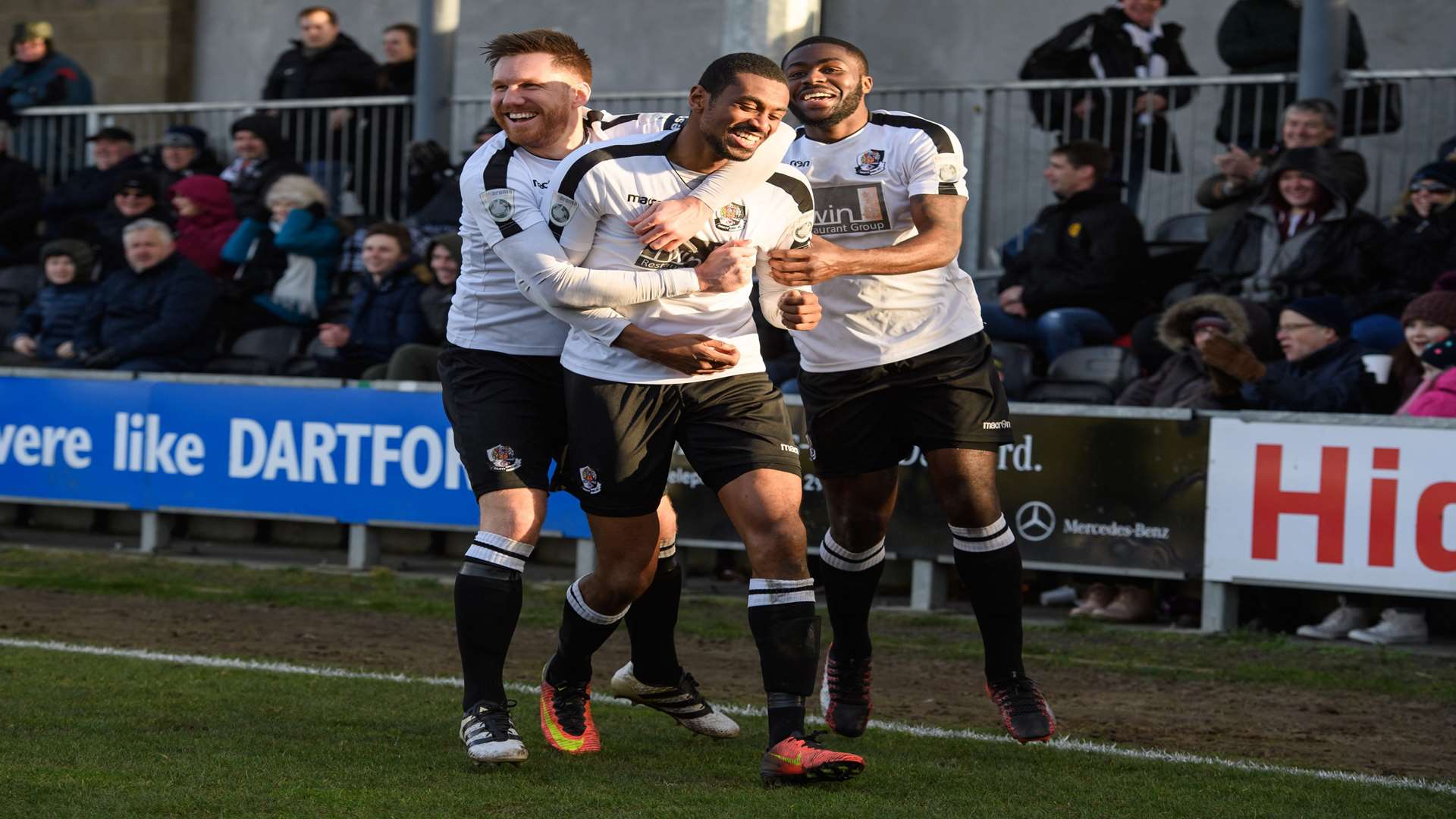 Danny Mills celebrates with Elliot Bradbrook and Mark Onyemah Picture: Andy Payton