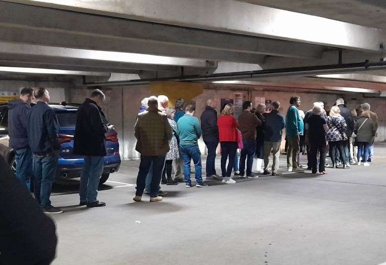 Audience members from the Leas Cliff Hall patiently wait to pay for parking in Folkestone’s Sandgate Road car park. Picture: Natasha Kerrigan