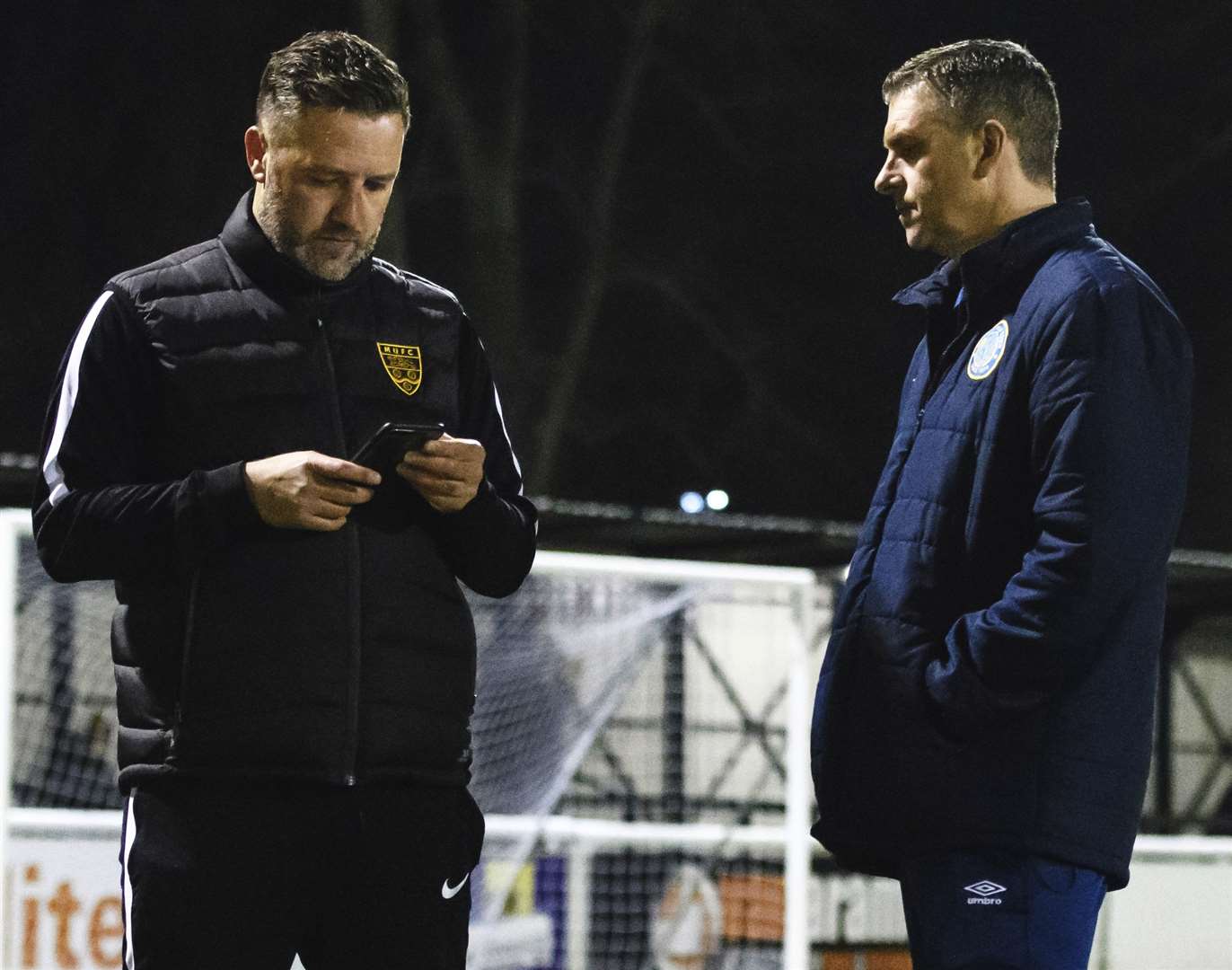 Maidstone manager Jay Saunders, left, with Macclesfield manager John Askey before the original game was postponed. Picture: Andy Payton