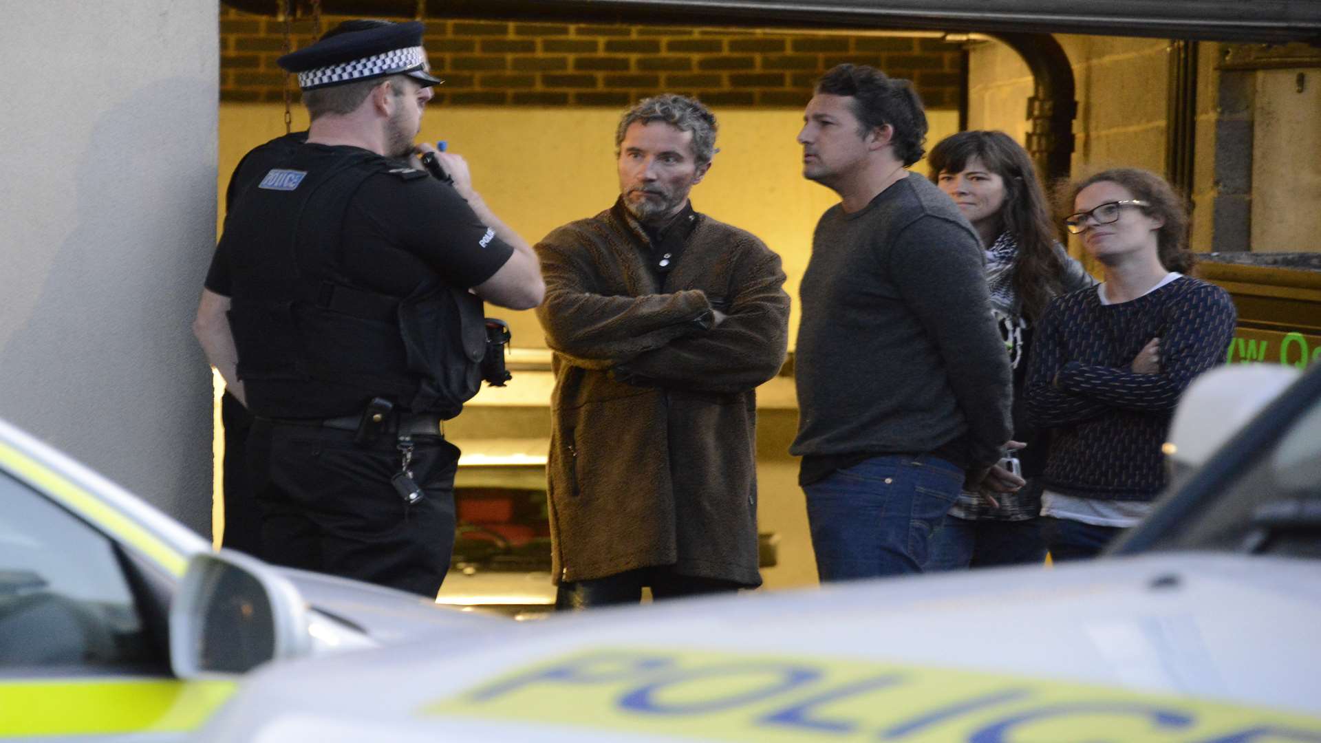 Police talk to art dealer Robin Barton (centre) who was overseeing the removal. Picture: Paul Amos
