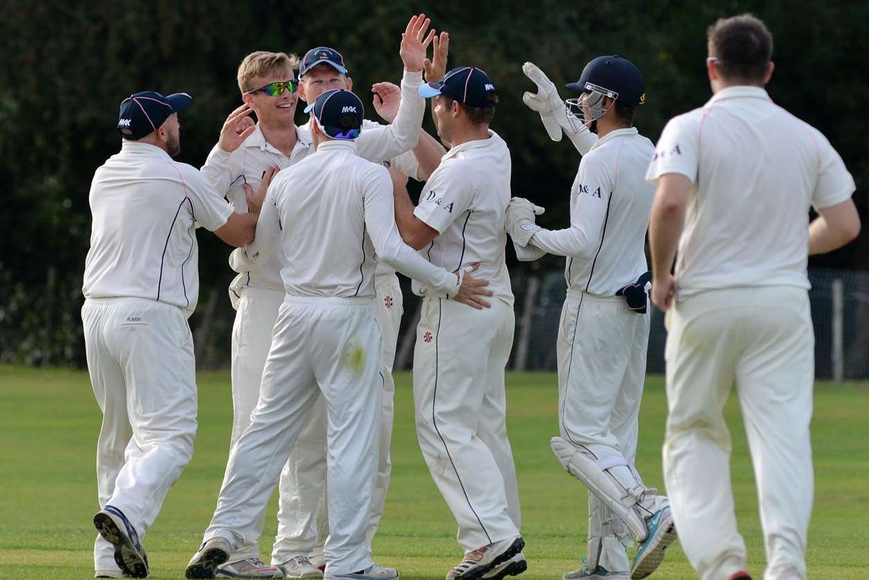 Hartley's Jack Laraman celebrates taking a Sevenoaks Vine wicket with his team-mates. Picture: Richard Eaton FM3342841
