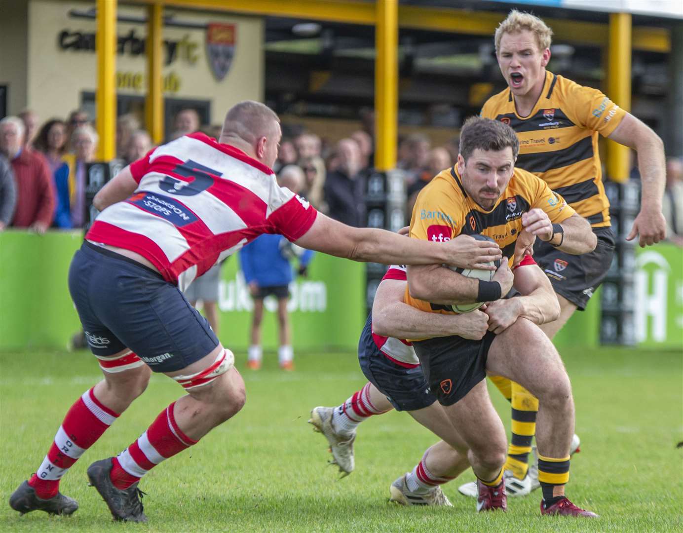Canterbury's Ross Howard tries to avoid Dorking's clutches. Picture: Phillipa Hilton