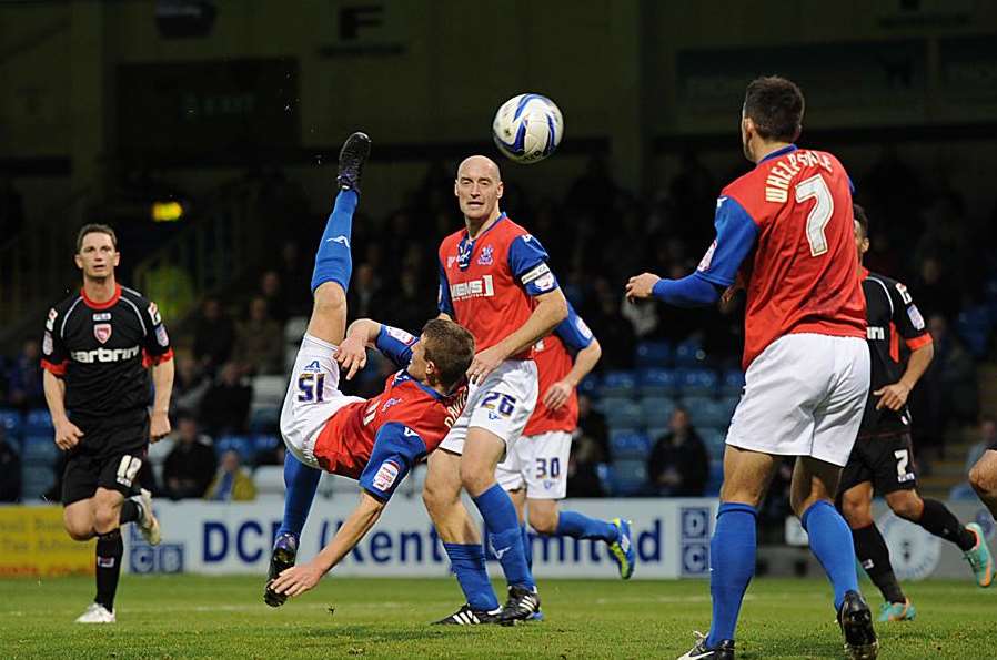 Callum Davies attempts an overhead kick as Adam Barrett looks on Picture: Barry Goodwin