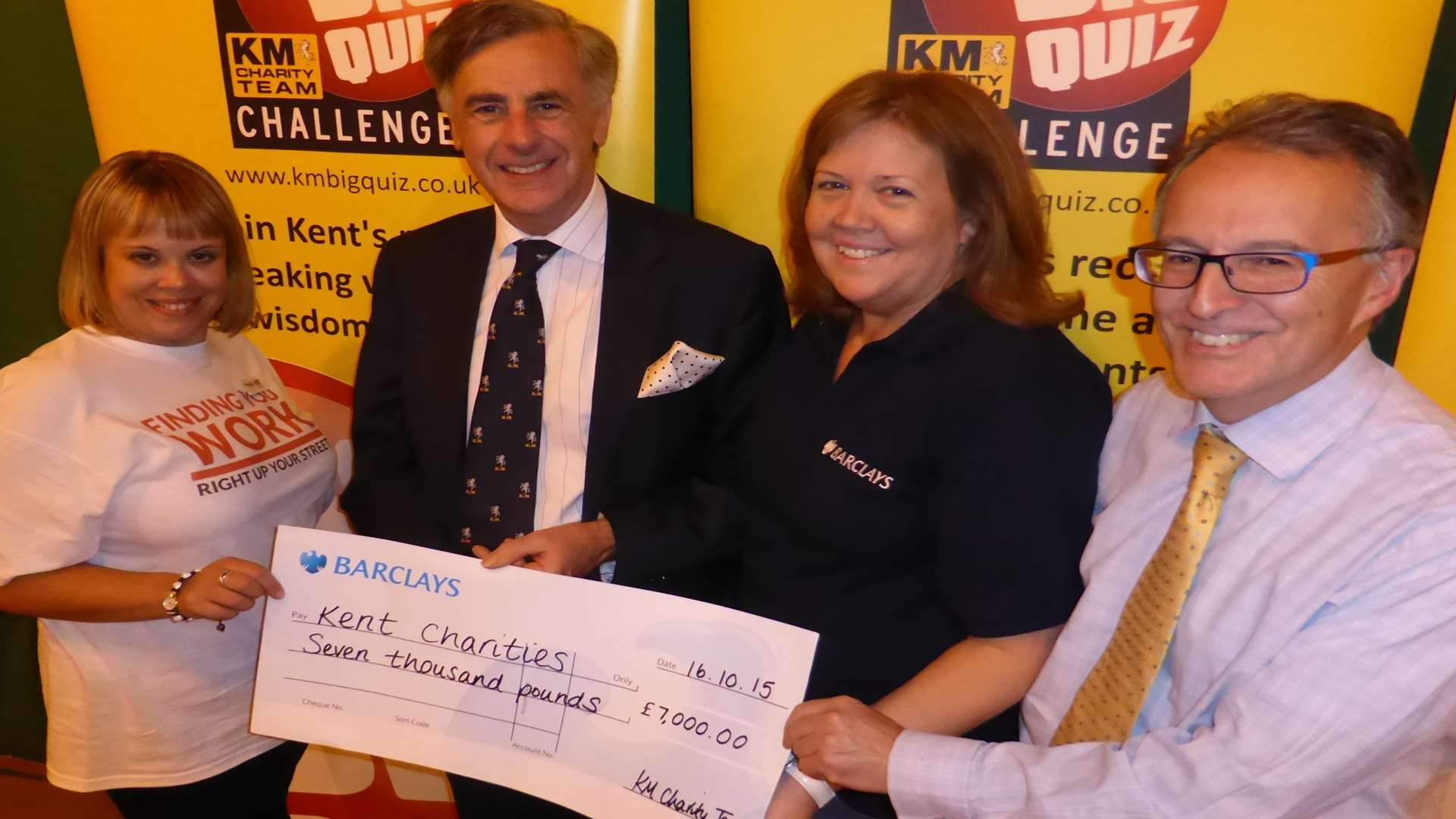 Ashford Big Quiz 2015 partners Carly James of HR GO, Richard Rix of Hallett and Co, Beverley Walsh of Barclays and Clive Perry of Specsavers announce the charitable figure raised. Booking is now open for the 2016 heat.