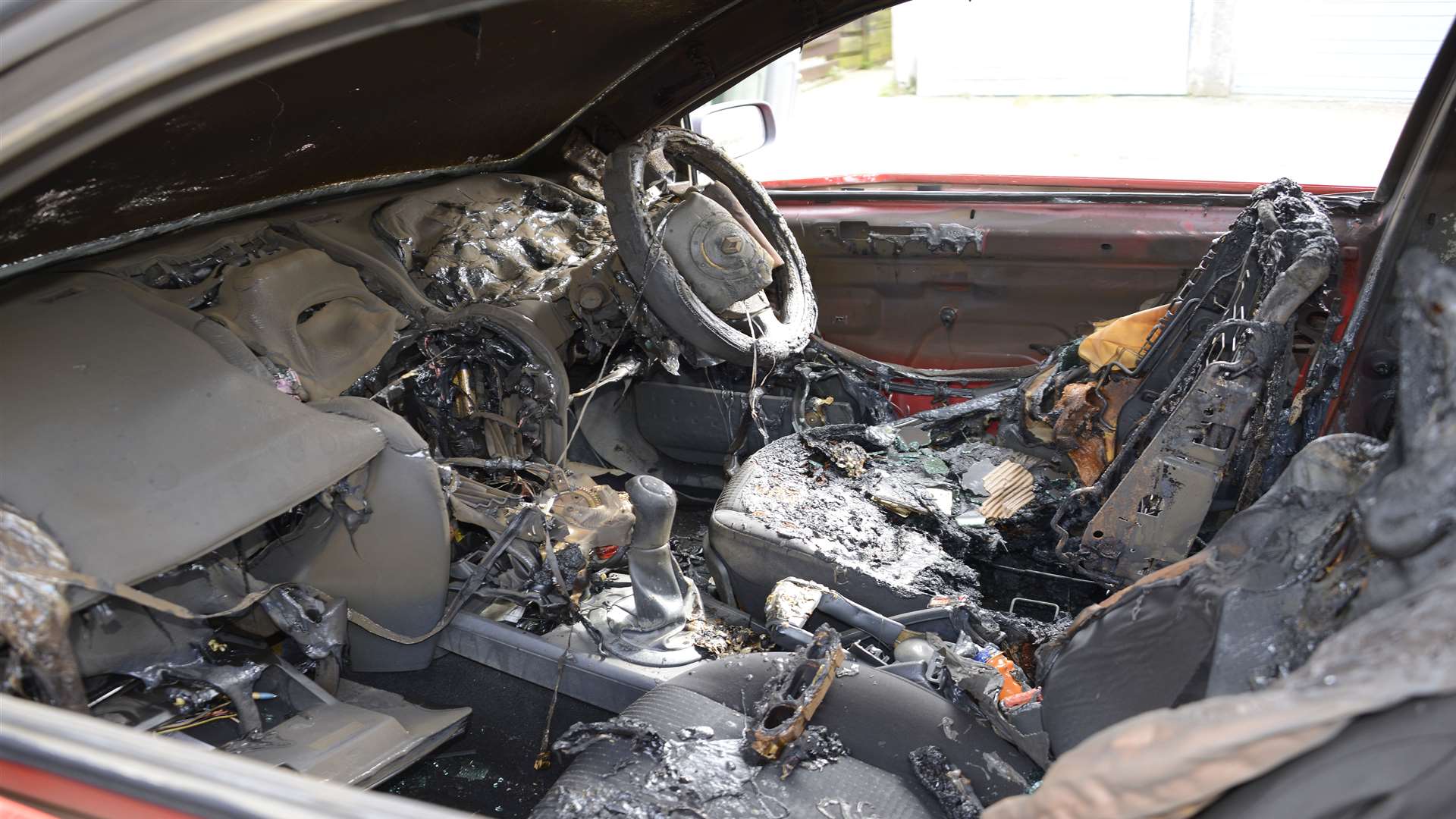 Gutted: Inside the burnt out car