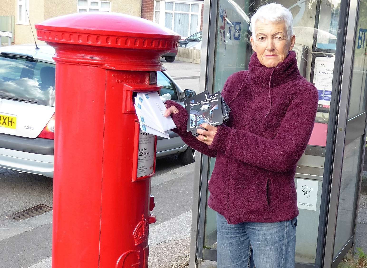 Ruth Simson posting the postcards to Discovery Park in Sandwich