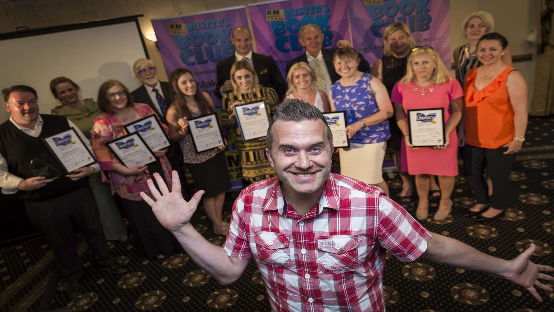 Buster Book Club Awards winners are joined by CBeebies' Phil Gallagher.