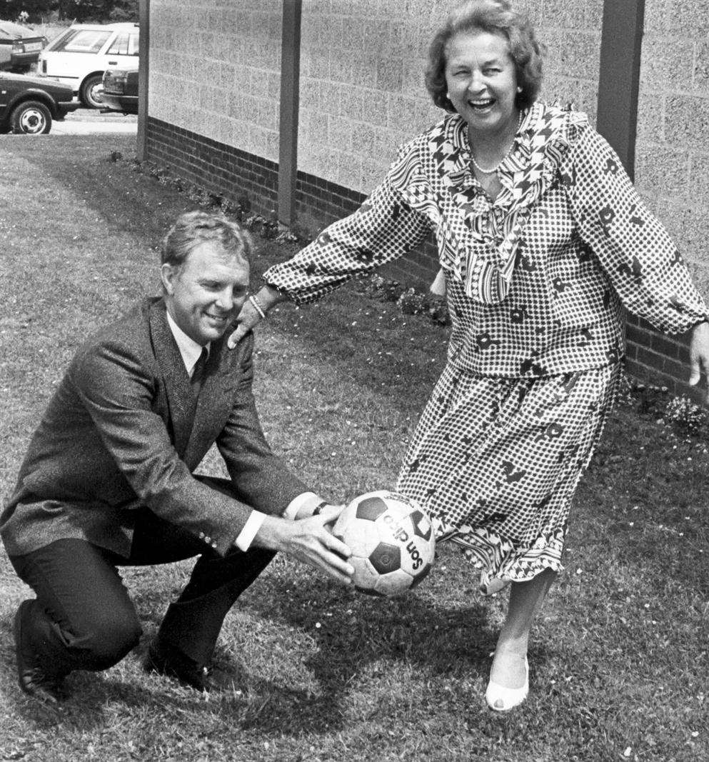Penny Fenner with Bobby Moore, captain of the world cup winning England football team of the 1960s. 14th July 1987.