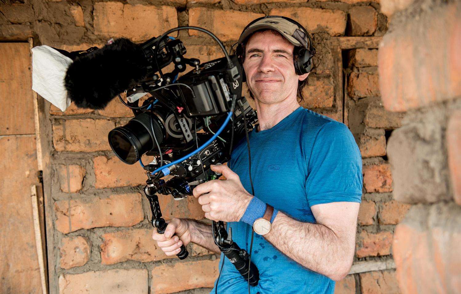 Dave Carter filming on the Sightsavers assignment in Malawi. Picture: Rachel Palmer Photography