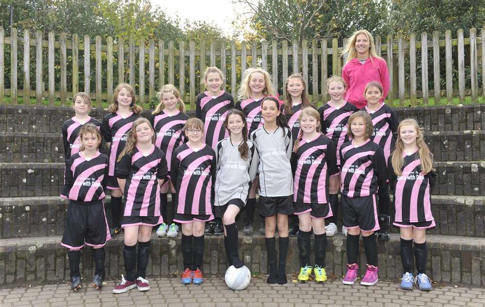 Danni Jenner-Relf with the girls football team in their new kit