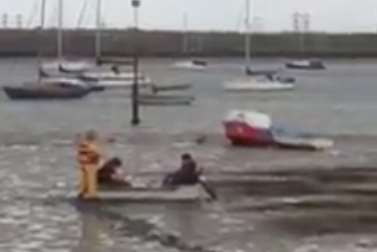 Firefighters and Coastguard in mud rescue