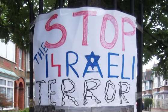 The poster reads: Stop the Israeli terror on civilians