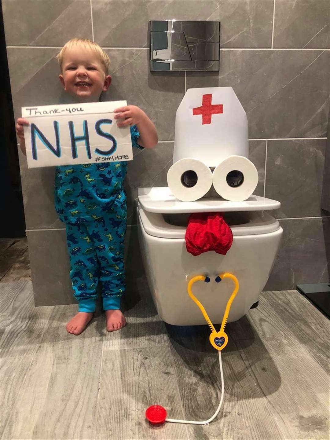 Hugo, 3, with his NHS toilet monster (32681131)