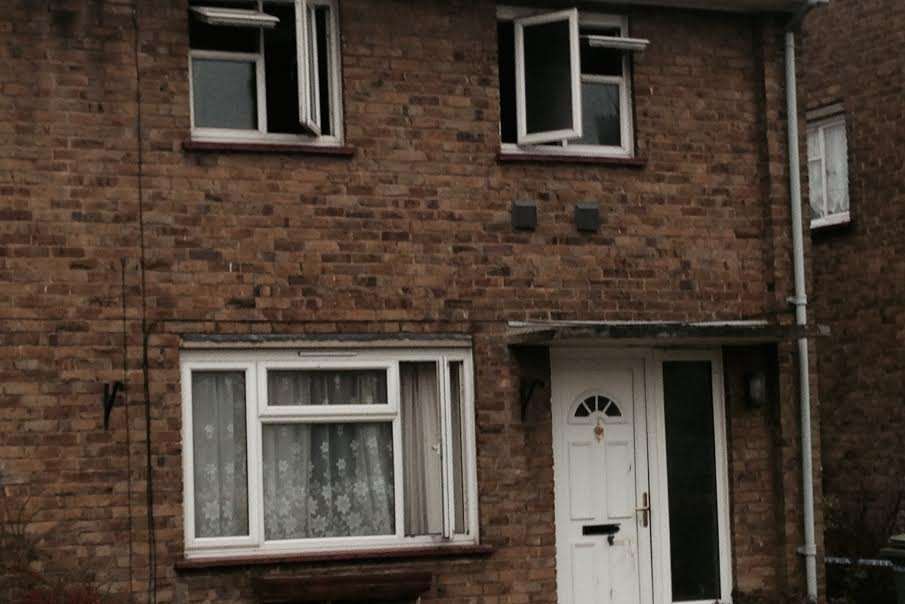 Upstairs windows were open and officers could be seen taking photographs