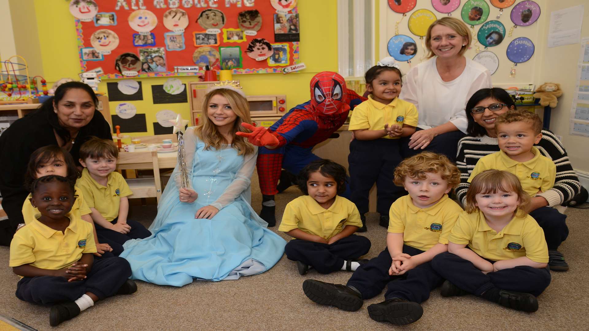 Teacher, Carole Lakha, Head of early years, Sharon Kybert and the children meet Spider Man and Cinderella