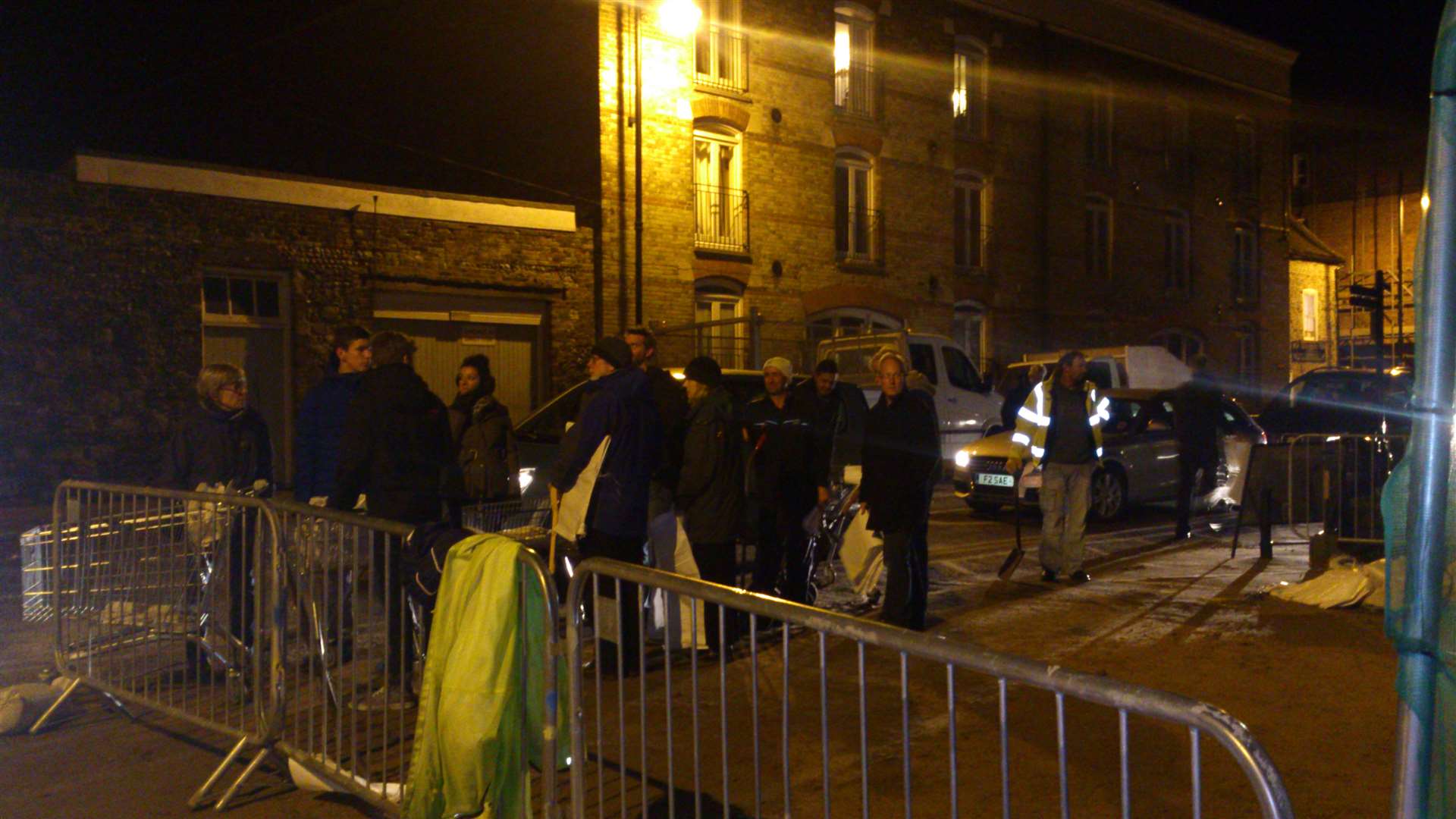 People queue to collect sandbags in Sandwich town centre