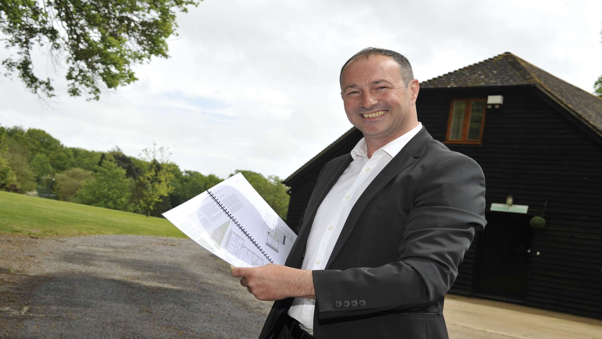 Owner Stuart Andrews with plans for his new boutique hotel.
