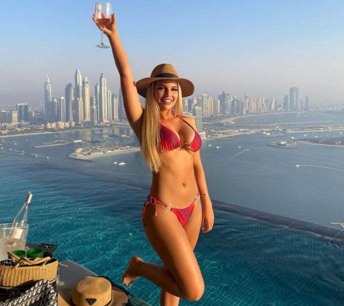 Ella raising a glass at the Aura Skypool in Dubai. Picture: @ellabarnes/Instagram