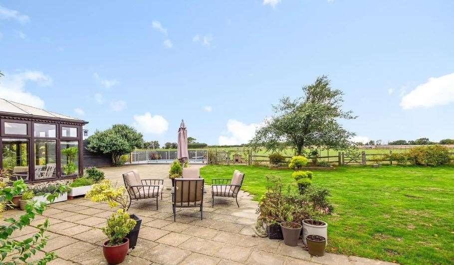 The cottages are set within the property's gardens, which include a terrace and views of the countryside. Picture: Equus Country and Equestrian