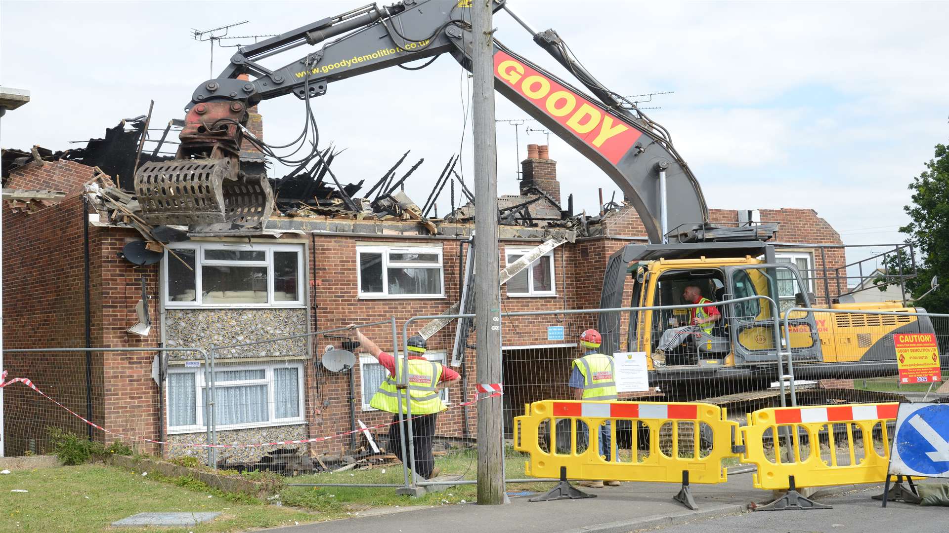 Demolition beginning at the scene of the fire in Little Knoll
