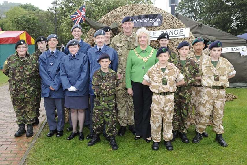 Braving the rain, members of the Cadet Forces with Lt Col Andrew Hodkinson and Dover Mayor Cllr Ronnie Philpott.