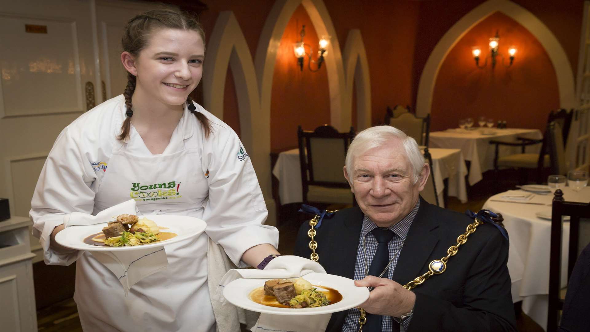 Charlotte Fife, 15, from Invicta Grammar, serves Cllr Malcolm Greer, mayor of Maidstone, at the Young Cooks VIP luncheon.