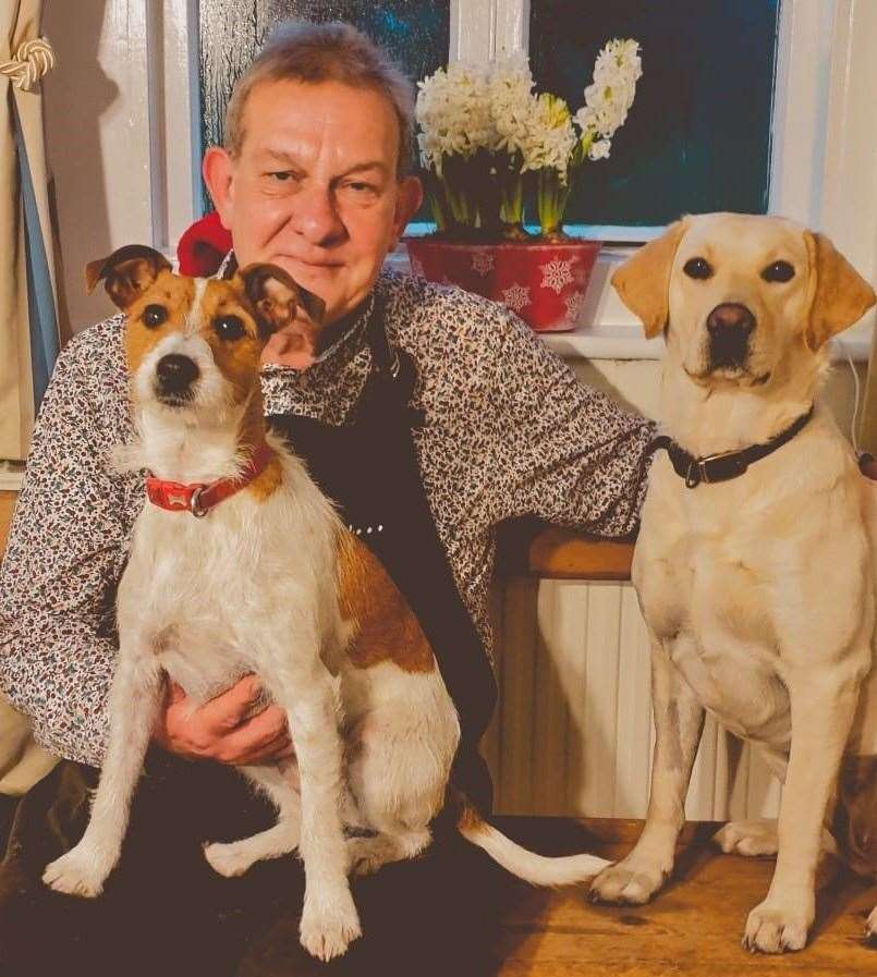 Current owner Mark Harris with pet dogs
