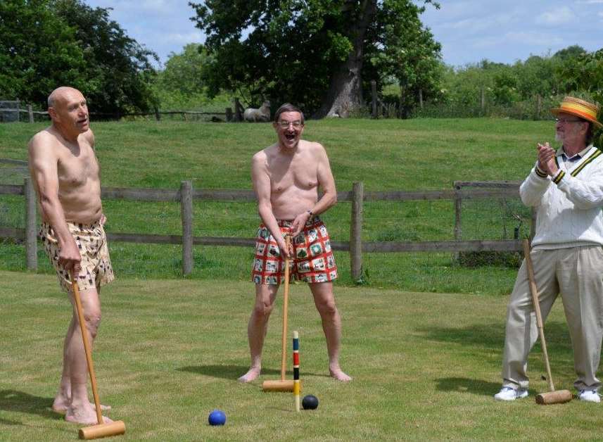 Ken Vizard, Robert Assirati and Charles May enjoy a game of croquet in their boxers