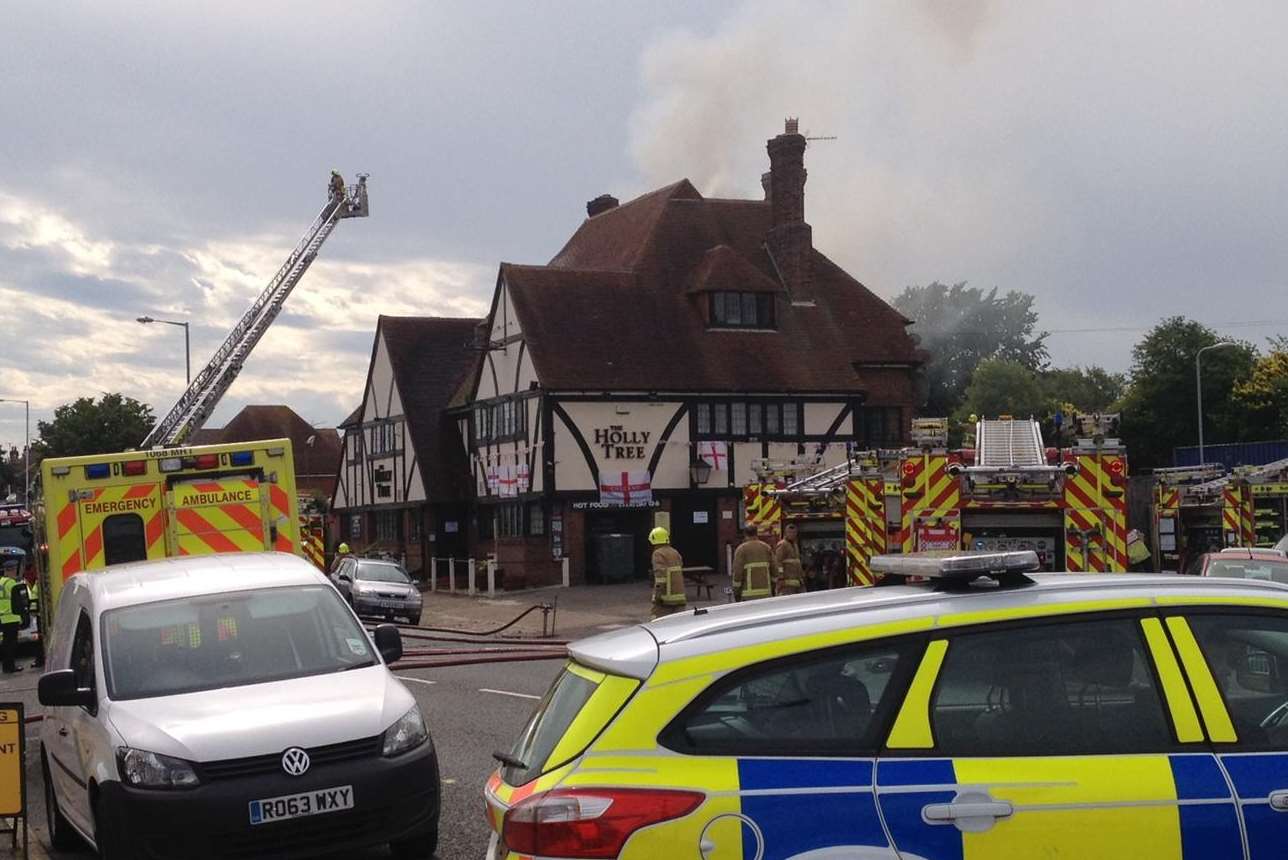 Firefighters tackle the blaze at the Holly Tree pub in Northdown Road, Cliftonville