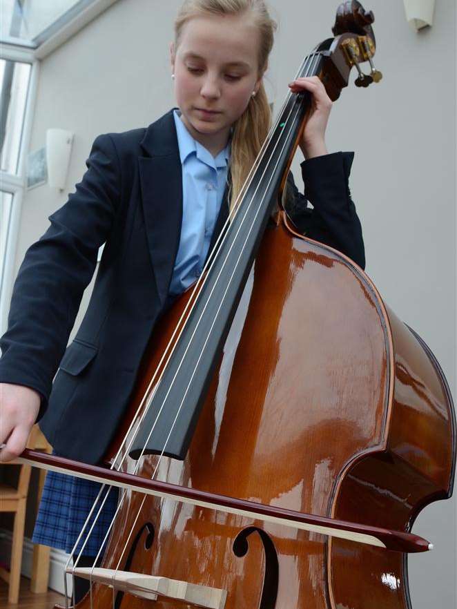 Ophelia Gregory practising on the double bass