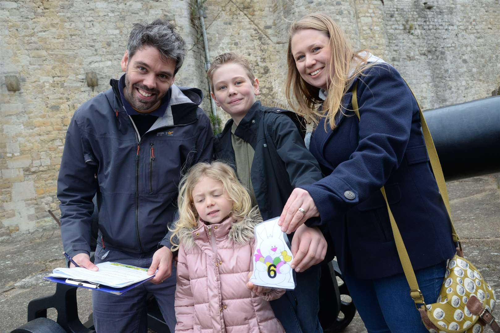 Anthony and Sarah Boxall with children Ethan, 12 and Esme, six find one of the clues during the Easter Egg trail around Upnor Castle, Rochester on Saturday. Picture: Chris Davey..... (8313838)