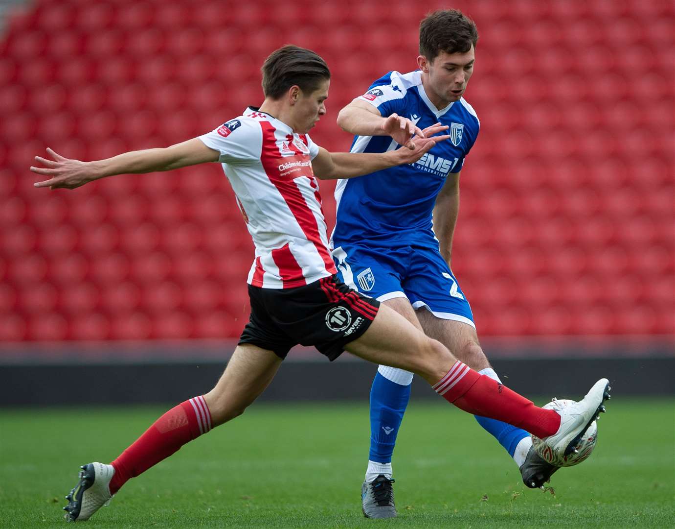 Tom O’Connor’s ball forward is closed down by Sunderland's George Dobson on Saturday Picture: Ady Kerry
