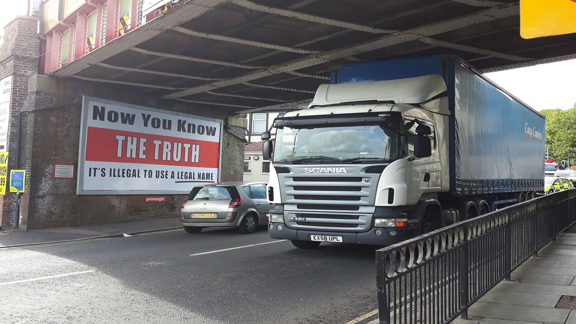 The lorry wedged under the bridge