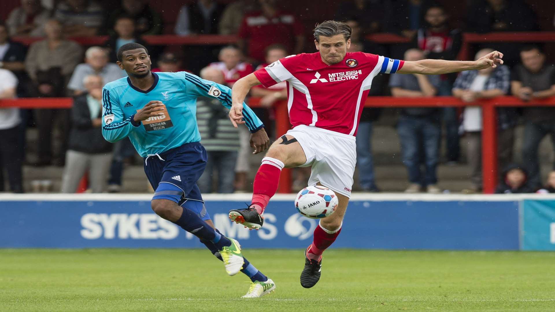 Ebbsfleet captain Tom Bonner gets to the ball ahead of Danny Mills Picture: Andy Payton