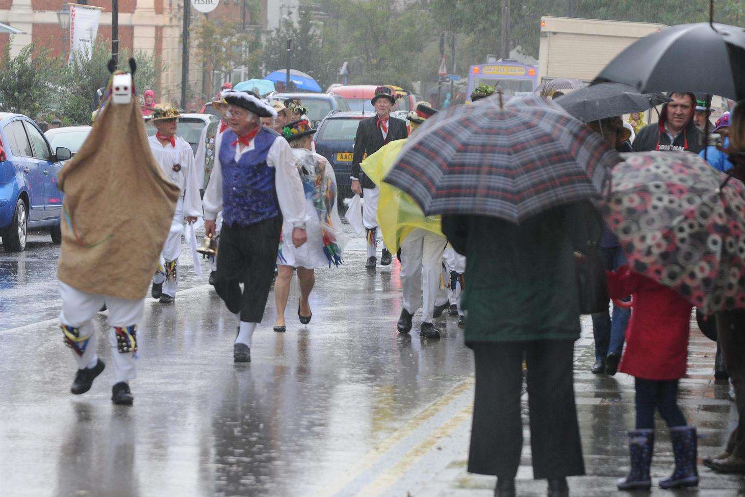 Dancers from Woodchurch Morris Men braved the rain to take part in Tenterden Folk Festival's procession.