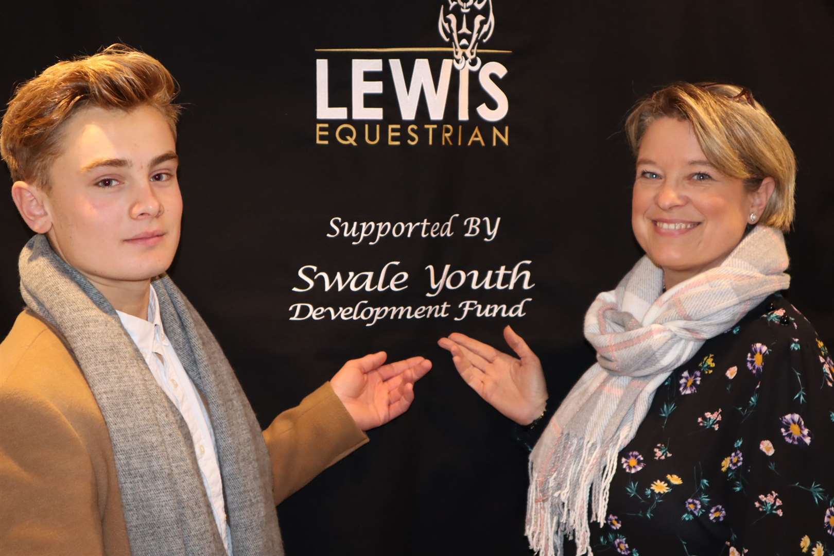 Sittingbourne showjumper Will Lewis with his mum Nikki and their new stable drape thanks to the Swale Youth Development Forum (22422147)
