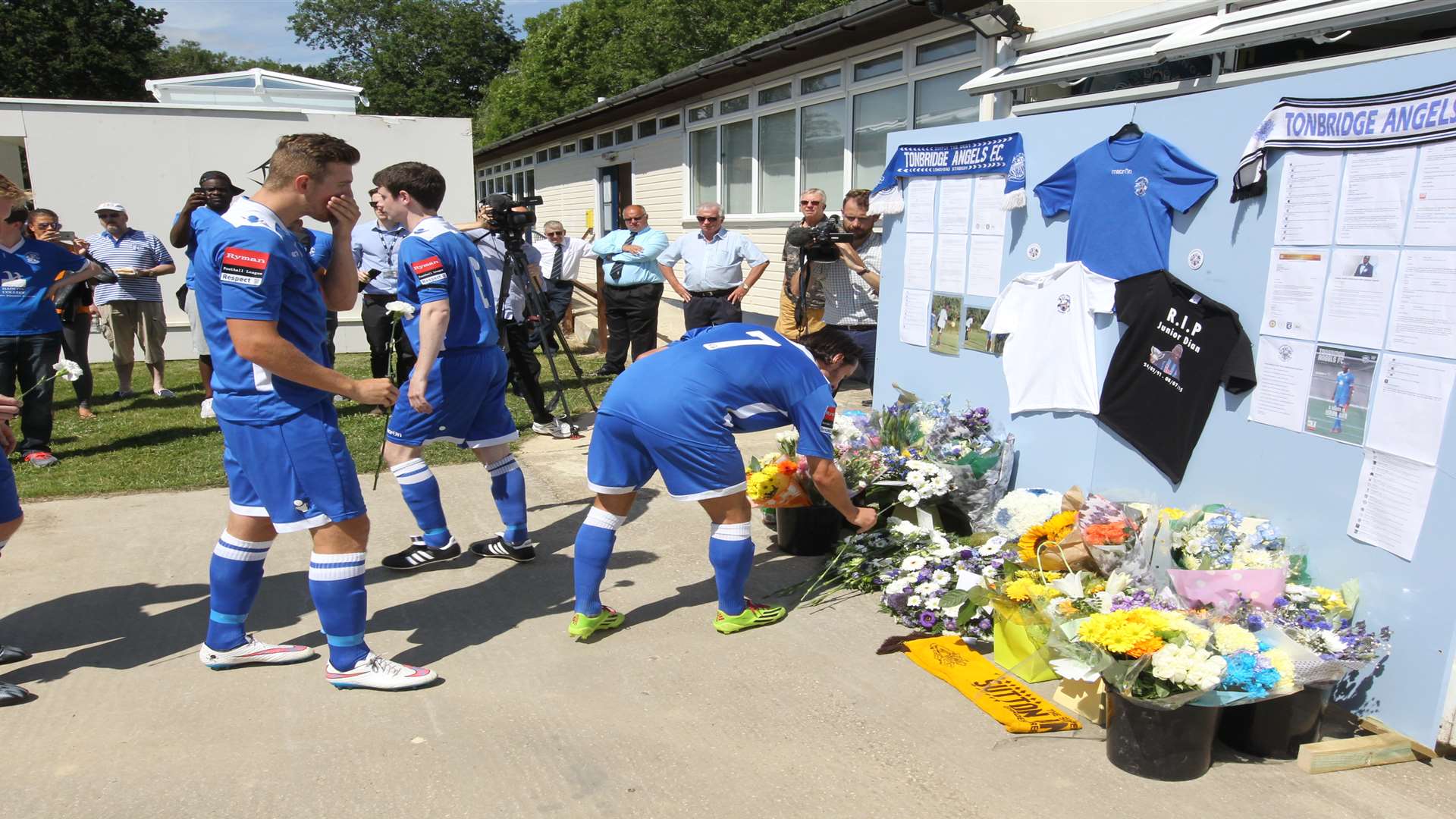 Tonbridge in blue and Gillingham in red pay their respects to Junior Dian