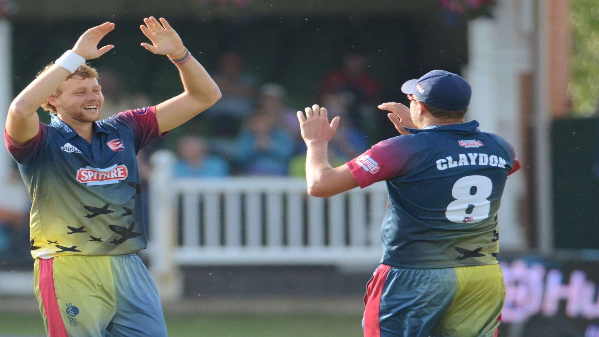 Ivan Thomas celebrates taking the wicket of Jesse Ryder with team-mate Mitch Claydon Picture: Gary Browne
