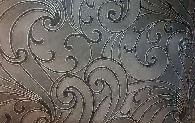 I spotted this flamboyant textured silver/grey wallpaper in the entrance area to the toilets