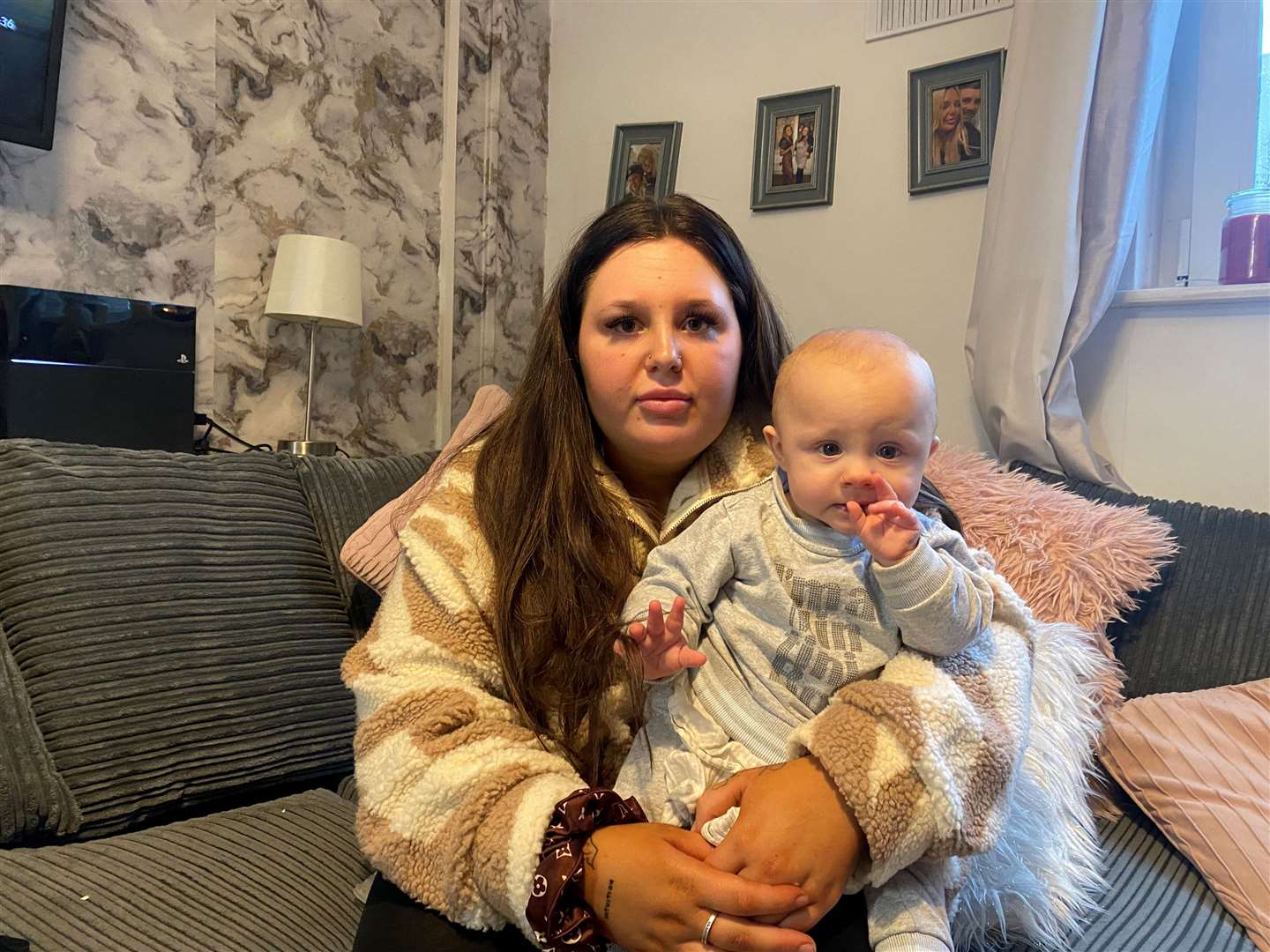 Courtney Fenton and her son Beau in their home at Elizabeth Court in Herne Bay