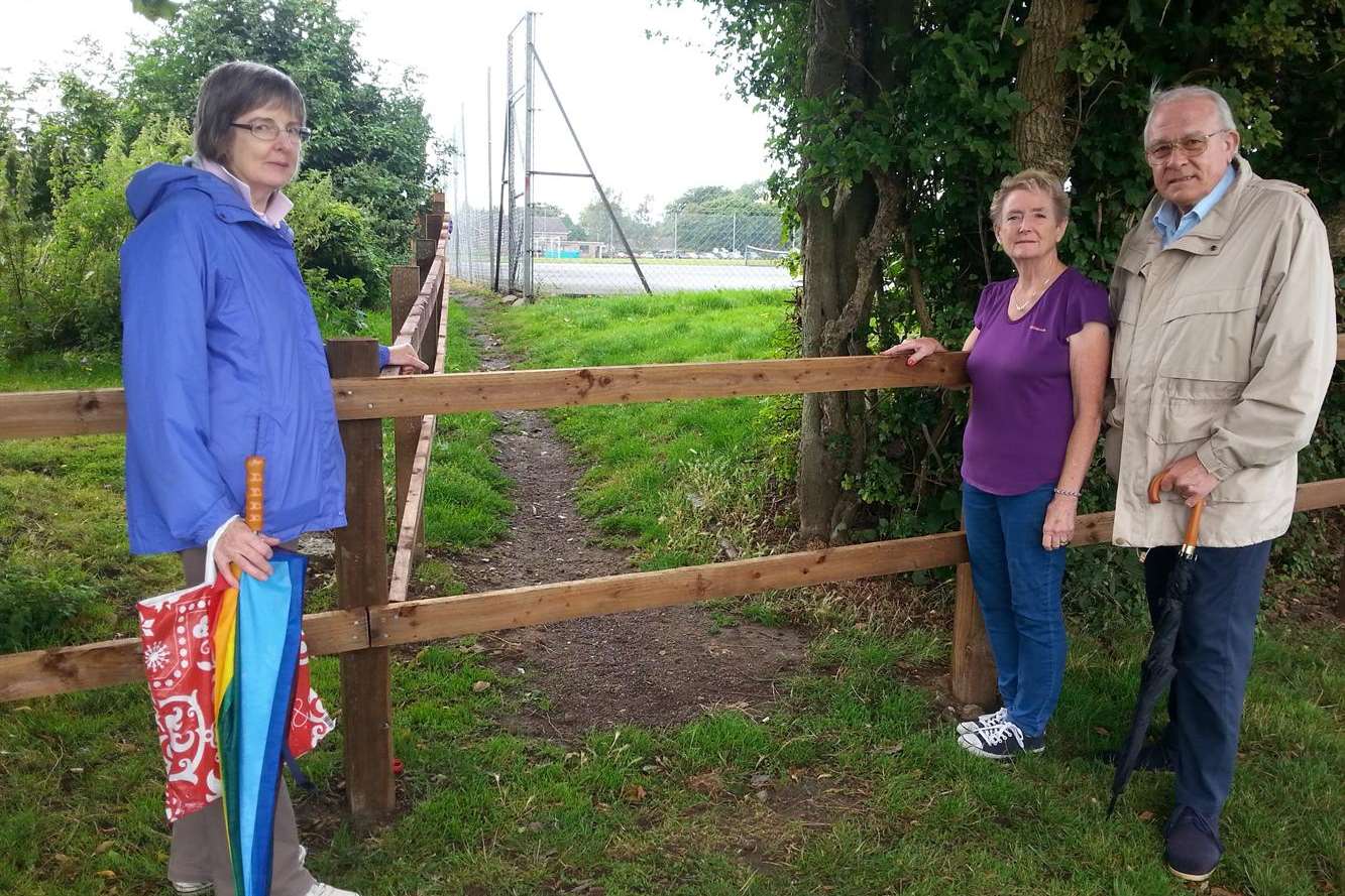 Ruth Coleman, tennis club secretary Jenny Waterman and Richard Coleman at the point where the path has been blocked.